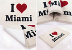 Hand-knotted wool I Love Miami sketch rug in pink and teal